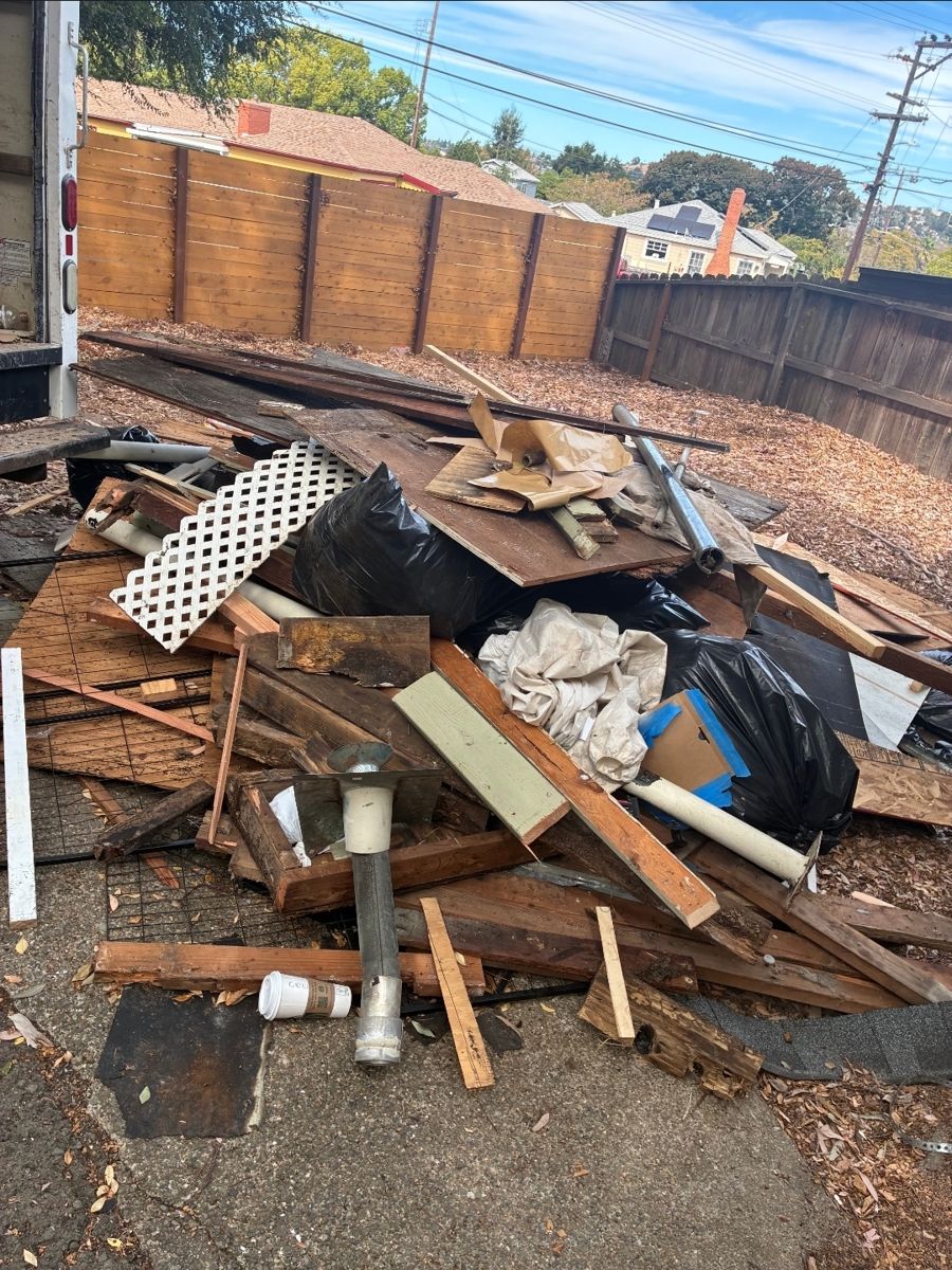 Before: Yard Lumber & Pipe Cleanup